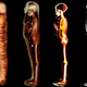 CT scans of the mummy revealed the boy's skeleton and amuluts (white spots on rightmost scan).